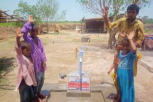 Picture of a family using water pumps installed by Deen Trust.